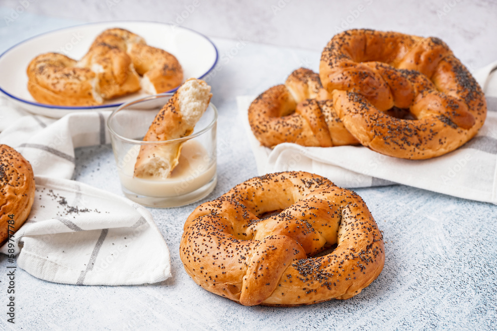 Tasty pretzels and condensed milk on light background Tasty pretzels and condensed milk on light background