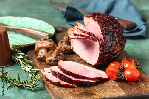 Glazed baked ham sliced on ...