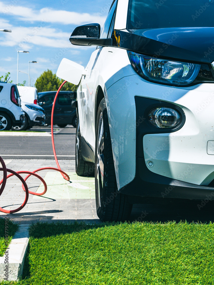 Charging an electric car on parking in a shopping mall.