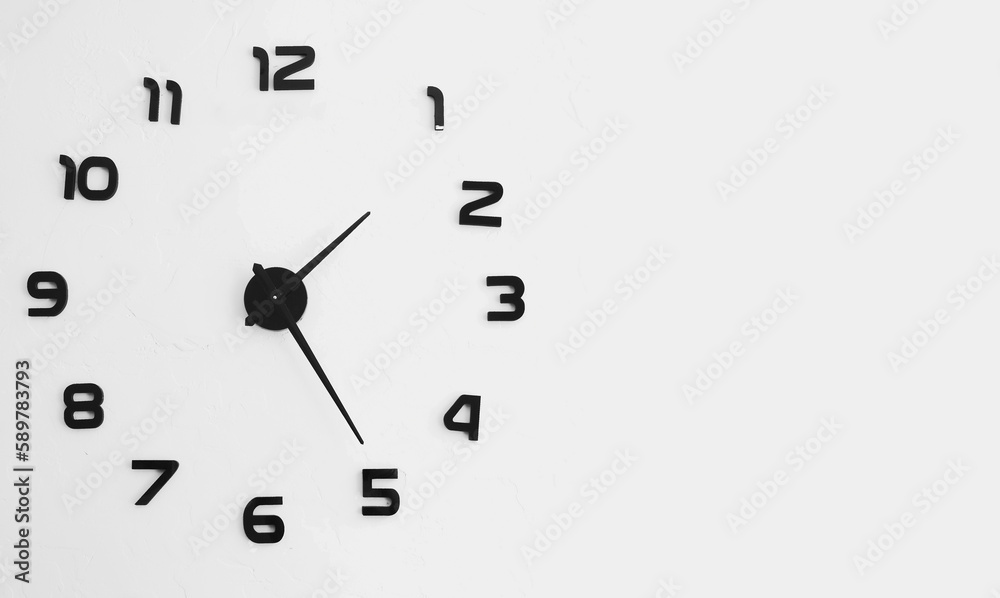 Minimalistic wall clock design with black numbers. Black round analog