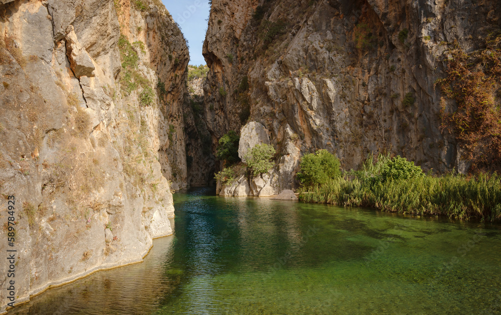 The scenic view of Guver canyon, beautiful clear water, Turkey Antalya, ormed through abrasion of the rocks by flowing waters over thousands of years The scenic view of Guver canyon, beautiful clear water, Turkey Antalya, ormed through abrasion of the rocks by flowing waters over thousands of years