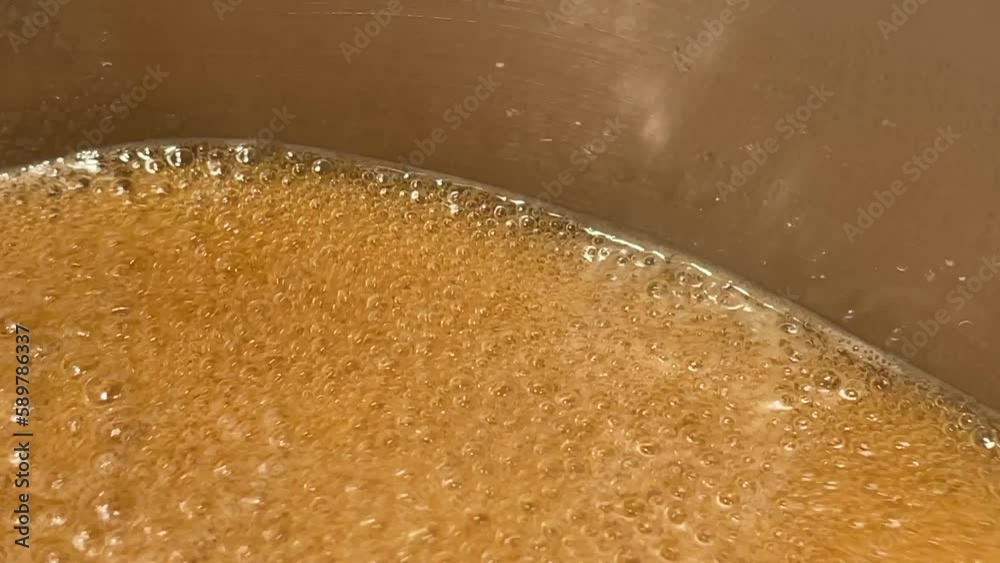 Sugaring process boiling Maple sap bubbling Close up 
