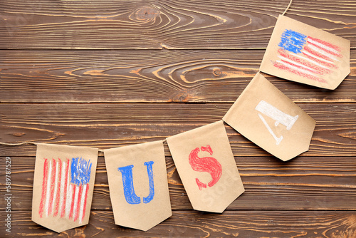 USA flags on wooden backgro...