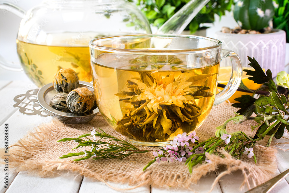 Blooming flower tea in a glass cup Blooming flower tea in a glass cup