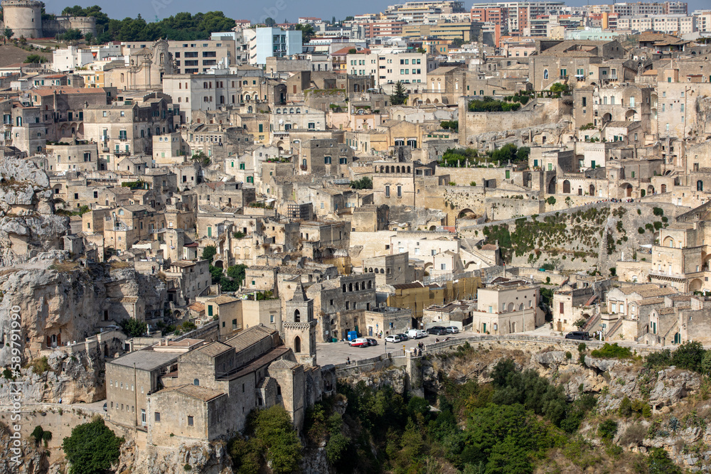 Panoramic view of Sassi di Matera a historic district in the city of Matera, well-known for their ancient cave dwellings from the Belvedere di Murgia Timone,  Basilicata, Italy