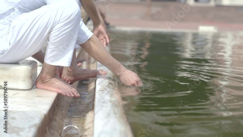 Muslim men doing ghusl or wuzu at Jama masjid Delhi before prayer photo