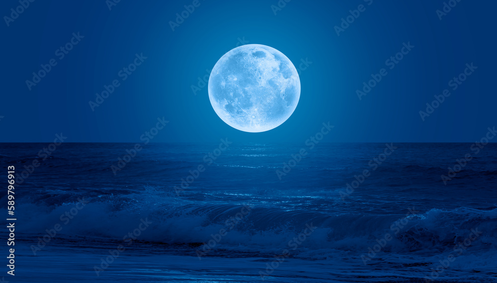 Super Full Moon. Colorful sky with cloud and bright full moon over seascape 