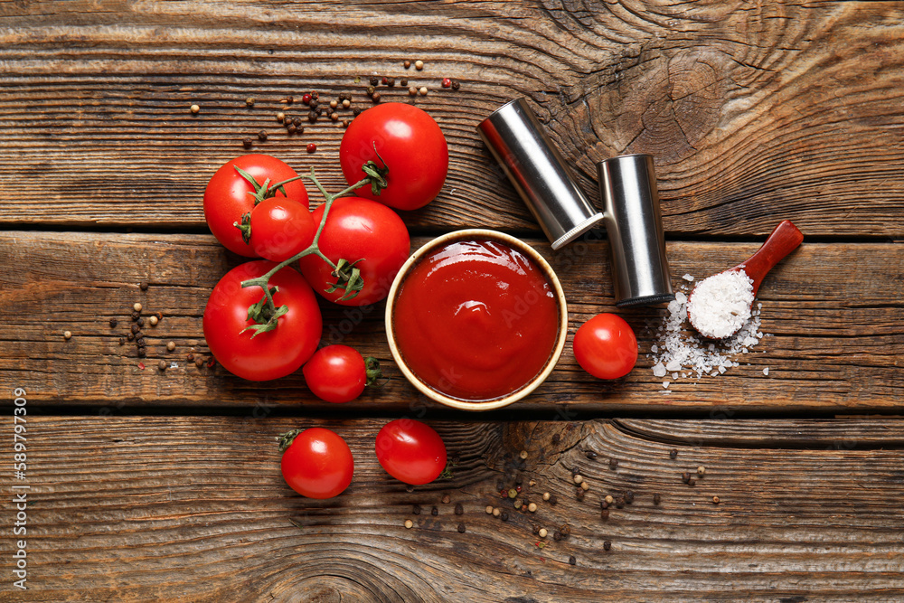 Bowl with tasty ketchup and fresh tomatoes on wooden background Bowl with tasty ketchup and fresh tomatoes on wooden background