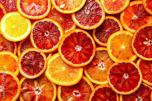 Many slices of juicy blood orange fruits as background