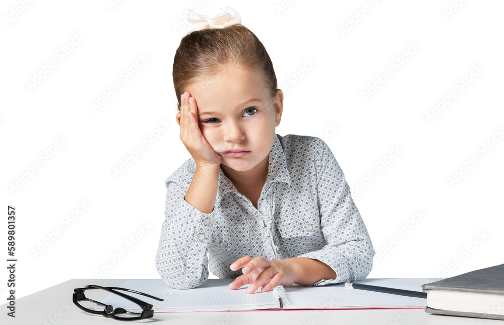 Bored girlt with hands on face sitting at desk Bored girlt with hands on face sitting at desk