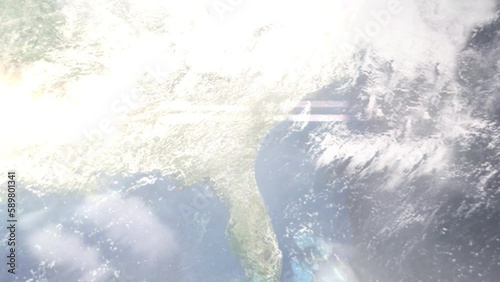 Earth zoom in from outer space to city. Zooming on Hinesville, Georgia, USA. The animation continues by zoom out through clouds and atmosphere into space. Images from NASA photo