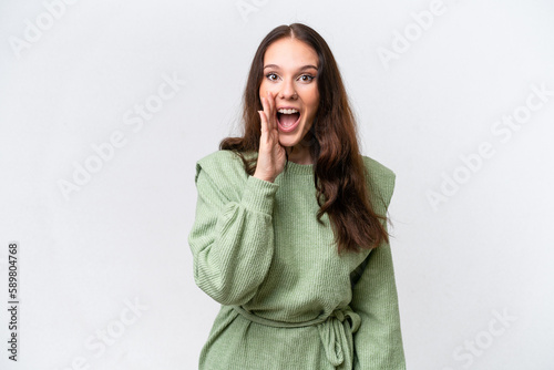 Young caucasian woman isolated on white background shouting with mouth wide open