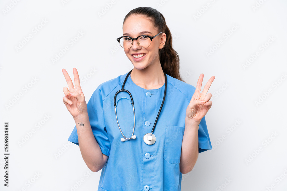 Young caucasian surgeon doctor woman isolated on white background showing victory sign with both hands Young caucasian surgeon doctor woman isolated on white background showing victory sign with both hands