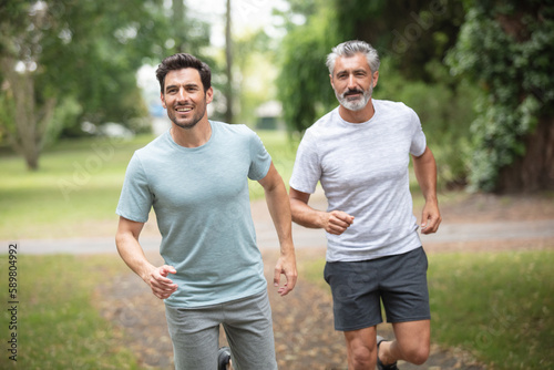 men or male friends running outdoors © auremar