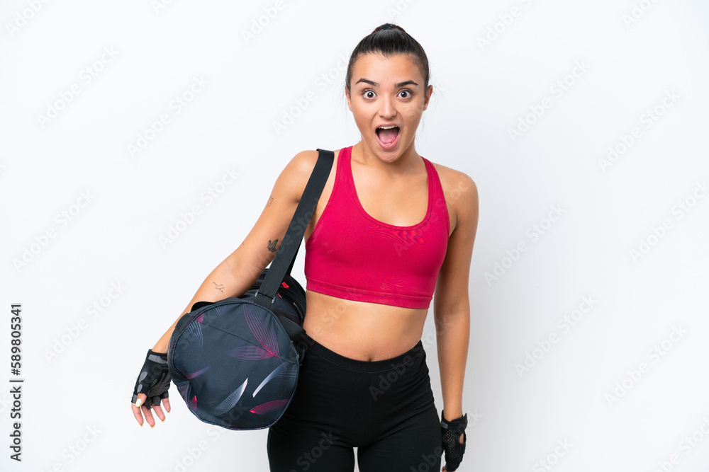 Young sport woman with sport bag isolated on white background with surprise facial expression Young sport woman with sport bag isolated on white background with surprise facial expression