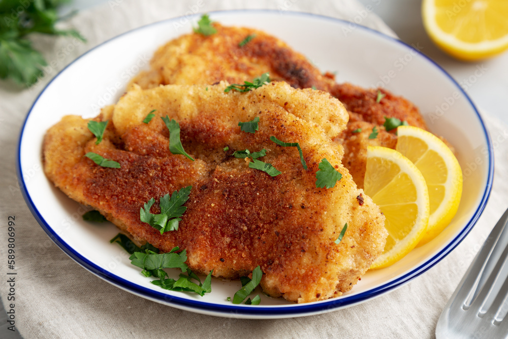 Homemade Chicken Cutlets on a Plate, low angle view. Close-up. Homemade Chicken Cutlets on a Plate, low angle view. Close-up.