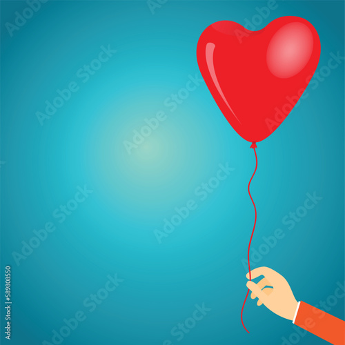 Hand holding a heart shaped balloon