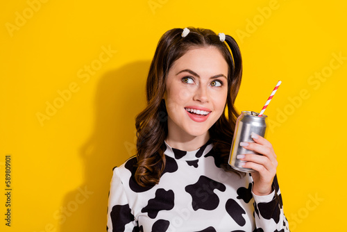 Photo of dreamy look empty space youth lady steel cup coke stick enjoy new sweet tasty brand liquid isolated on yellow color background