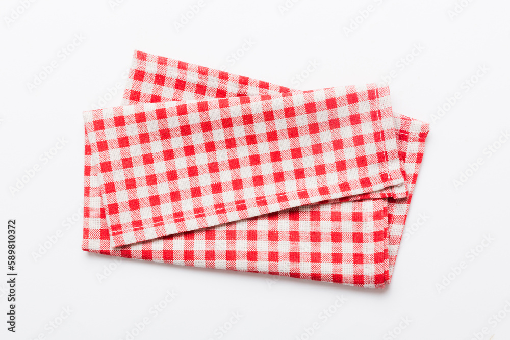 top view with red empty kitchen napkin isolated on table background. Folded cloth for mockup with copy space, Flat lay. Minimal style top view with red empty kitchen napkin isolated on table background. Folded cloth for mockup with copy space, Flat lay. Minimal style