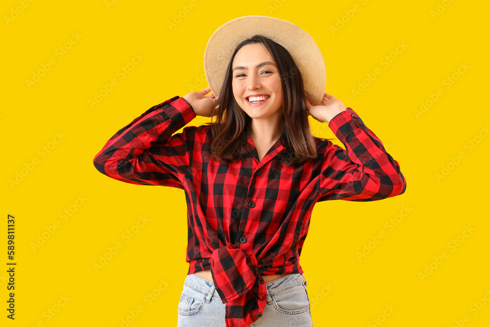 Young woman on yellow background. Festa Junina (June Festival) celebration Young woman on yellow background. Festa Junina (June Festival) celebration