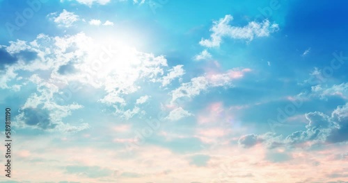 Dusty pink clouds run aqua blue sky with sun rays. Etherial watercolor natural palette. 4K time lapse. Lovely environmental colors. 
