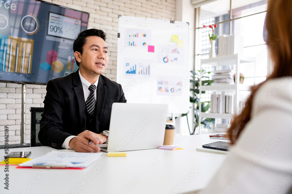 Professional Asian business adviser meeting to analyze and discuss the strategy of financial support of a tech company. Partnership start-up consultant. Professional Asian business adviser meeting to analyze and discuss the strategy of financial support of a tech company. Partnership start-up consultant.