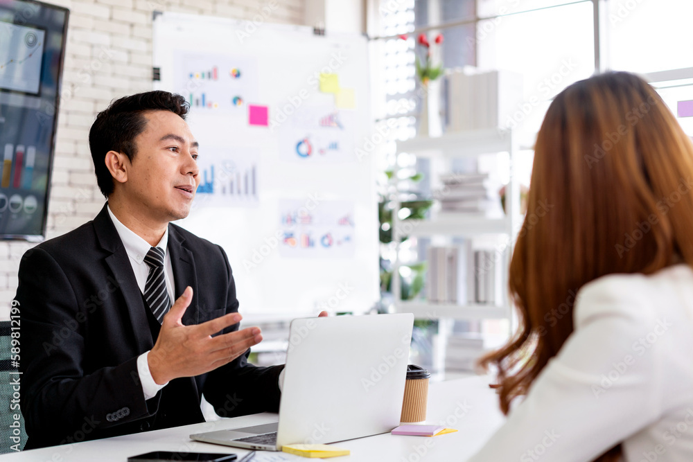 Professional Asian business adviser meeting to analyze and discuss the strategy of financial support of a tech company. Partnership start-up consultant. Professional Asian business adviser meeting to analyze and discuss the strategy of financial support of a tech company. Partnership start-up consultant.