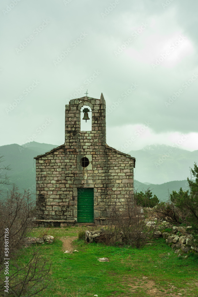 The old Orthodox Church of Sveti Vid 1327 on a hilltop in Montenegro above Tivat and Gorna Lastva on a tourist mountain trail