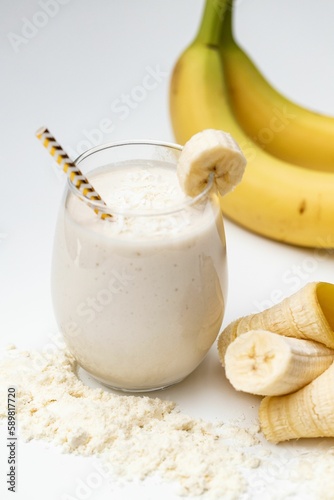 Milkshake with bananas in white background