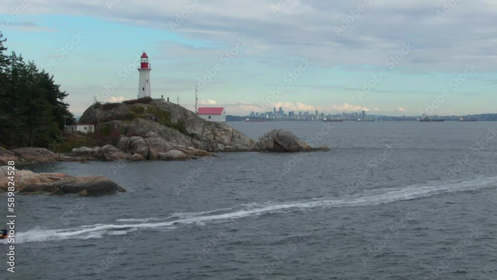 Drone shot of a the Point Atkinson Lighthouse on the coastline of the blue sea, British Columbia Drone shot of a the Point Atkinson Lighthouse on the coastline of the blue sea, British Columbia