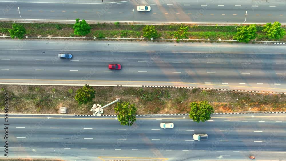 Aerial view shows the highway as a vital artery, linking towns and cities together. The cars on 