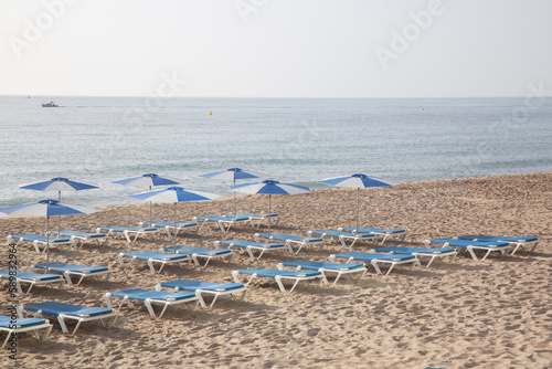 Fototapeta Naklejka Na Ścianę i Meble -  Sun Loungers on Beach, Villajoyosa, Alicante; Spain