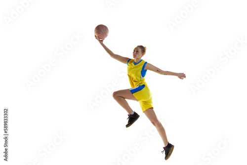 Dynamic image of young competitive young girl during basketball game, playing, training against white studio background. Concept of professional sport, hobby, healthy lifestyle, action and motion