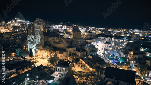 Aerial view of illuminated streets and fairy chimneys at Goreme village