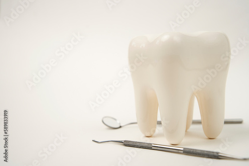 White healthy tooth, and dental tools for dentistry