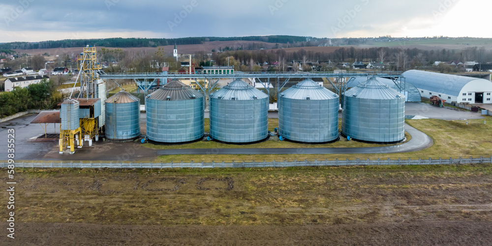 aerial panoramic view on silos and agro-industrial complex with grain drying line aerial panoramic view on silos and agro-industrial complex with grain drying line