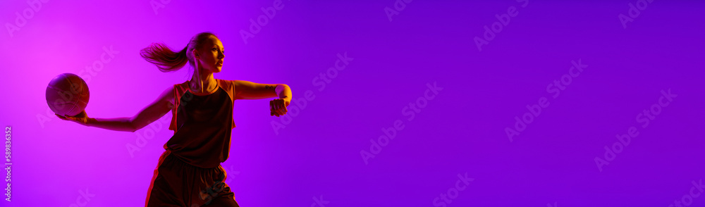 Young concentrated girl, female basketball player in motion, training, playing against white studio background. Professional sport, hobby, healthy lifestyle, action concept. Banner. Copy space for ad