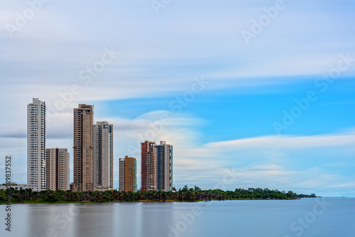 Long exposura of skyscrapers near the lake photo