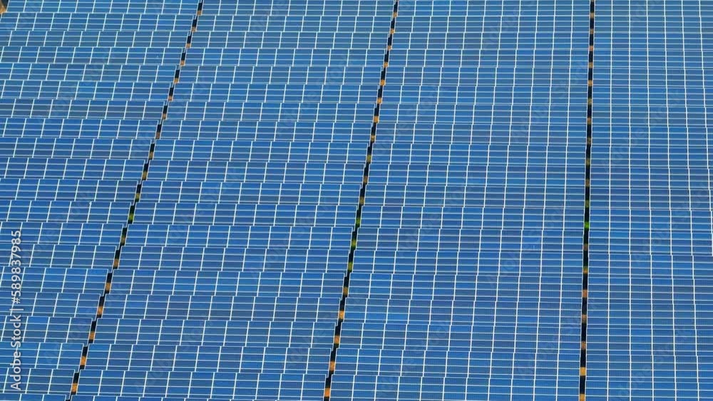 A vast array of solar panels spread across the landscape, glistening in the sunlight, represents a significant step forward in the fight against climate change. solar energy and environment concept. 
