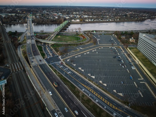 Aerial of the cityscape of Trenton, New Jersey, cars driving along the highways at sunrise