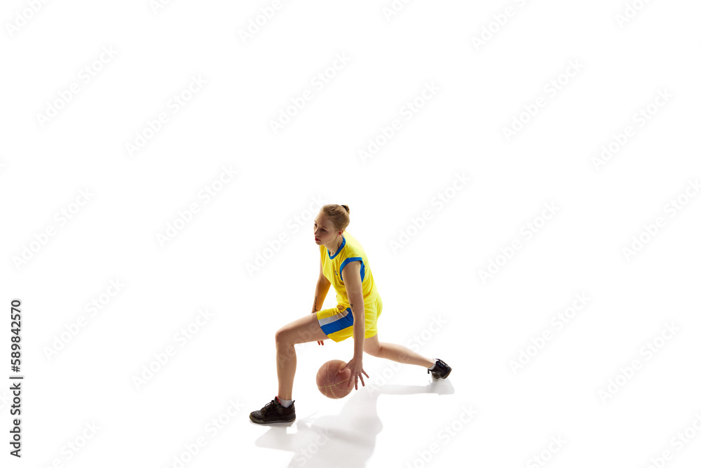 Dribbling exercises. Young girl, female basketball player in motion, playing, training against white studio background. Isometric view. Professional sport, healthy lifestyle, action and motion concept