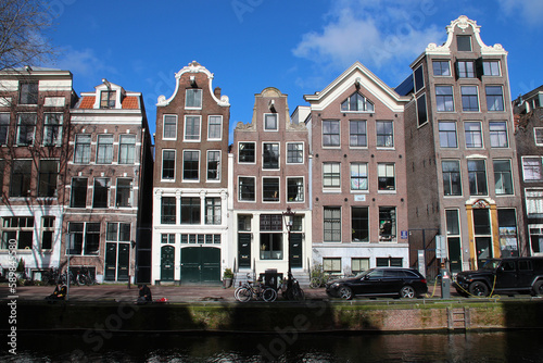 canal and old brick houses in amsterdam (the netherlands) 