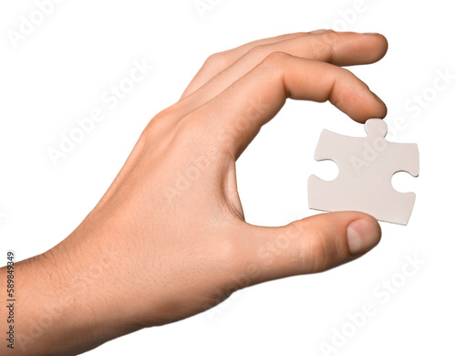 Hand Holding a Puzzle Piece