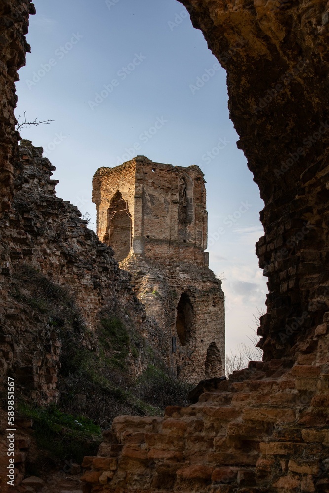 Vertical shot of a medieval Bac fortress illuminated by sun rays in Bac, Serbia
