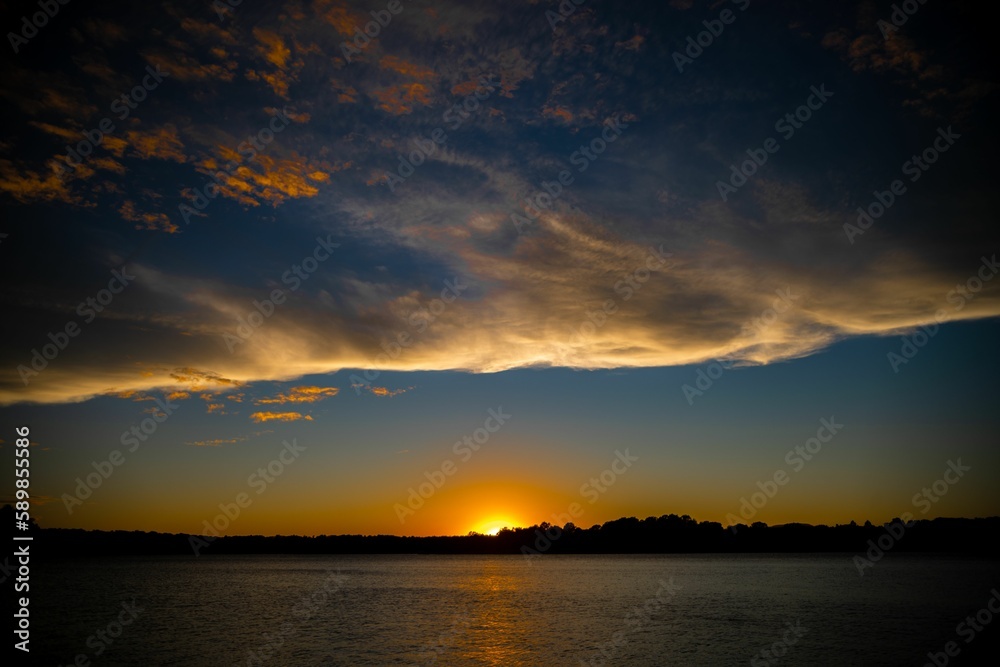 Beautiful shot of a sunset sky over the lake