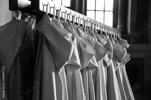Grayscale shot of a set of tunics worn by the monks of the Monastery of Montserrat