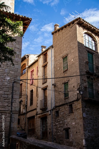 Fototapeta Naklejka Na Ścianę i Meble -  Narrow street with traditional residential buildings in old town of Solsona in province of Barcelona