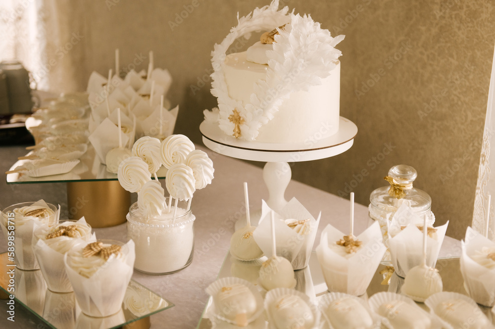 white cake and candy bar for baby's baptism