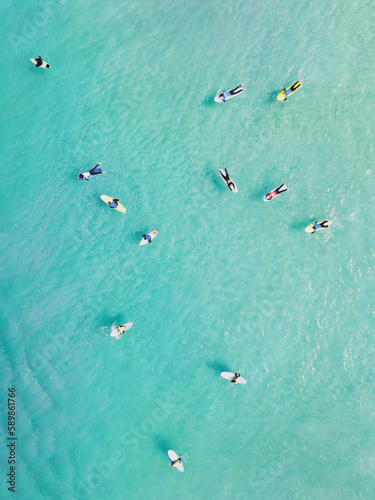 Obraz na płótnie View from above, stunning aerial view of a person surfing on a turquoise ocean. Fuerteventura, Canary Islands, Spain. w salonie