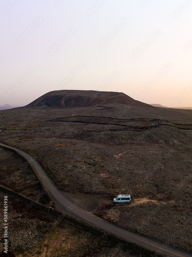 View from above, stunning aerial view of a van parked under the Calderon Hondo in Fuerteventura, Canary Islands